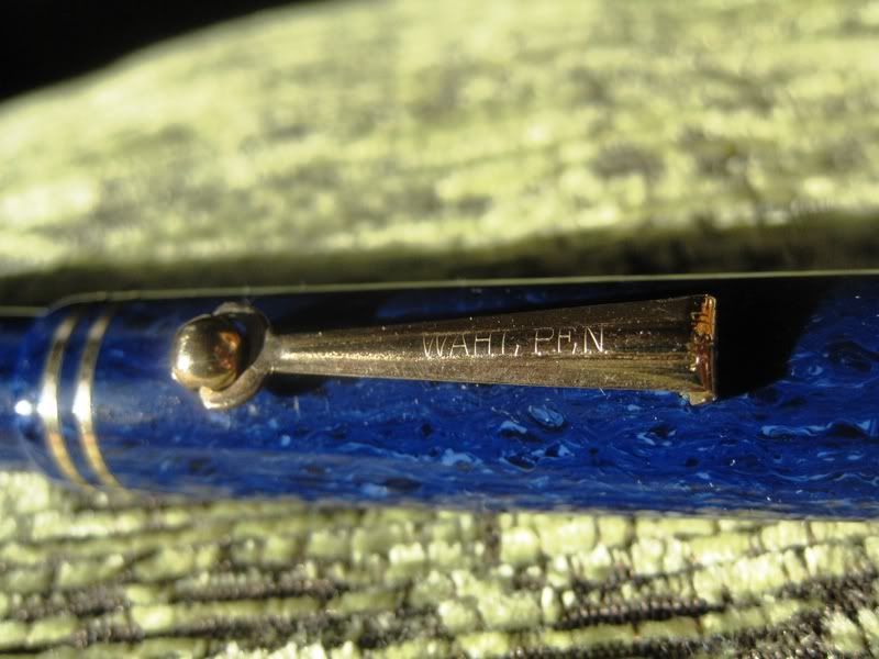 WAhlGoldSeal4BlueDetalleGrabadoClip.jpg