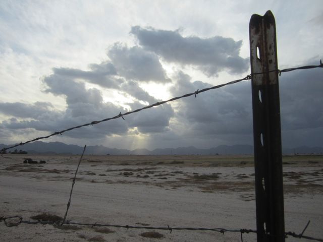 Fence and fierce sky